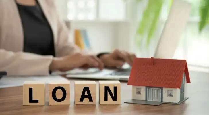 Borrower reviewing FHA loan requirements and mortgage documents