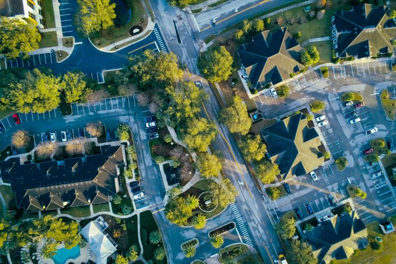 Aerial view of Lake Mary, FL, featuring residential streets surrounded by lush green trees.
