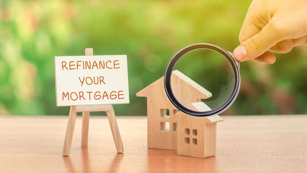 Homeowner reviewing mortgage refinance documents and financial options