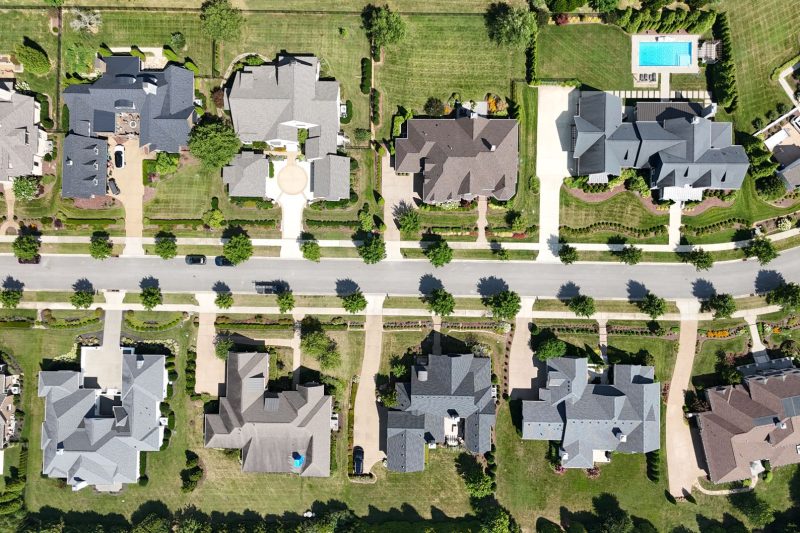 Overhead view of stylish homes surrounded by lush greenery in a suburban Tennessee neighborhood.